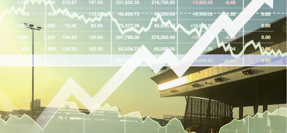 half finished construction with overlay of stocks