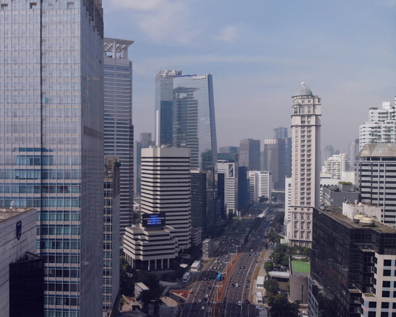 A busy metropolitan skyline with bustling traffic